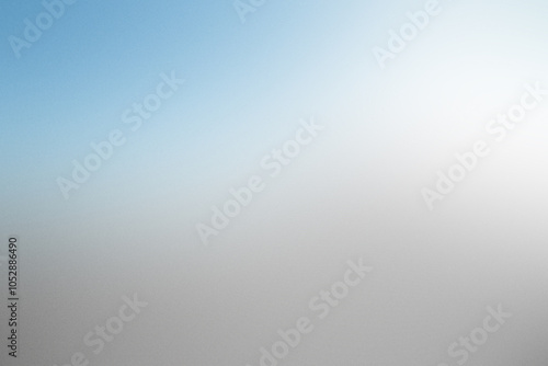 Abstract gradient background featuring noise and grain with a serene blend of blue and white tones