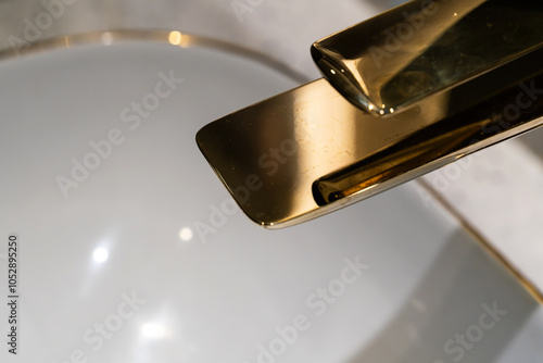 faucet and washbasin in the bathroom photo