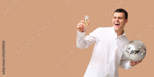 Happy young man with glass ...
