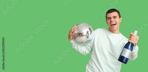 Happy young man holding dis...