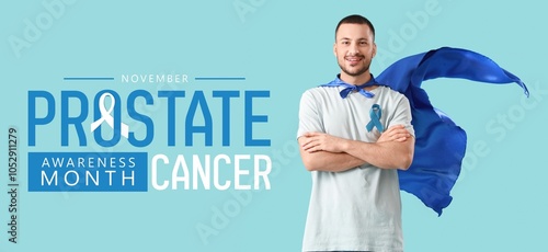 Young man in superhero cape and with blue ribbon on color background. Prostate Cancer Awareness Month