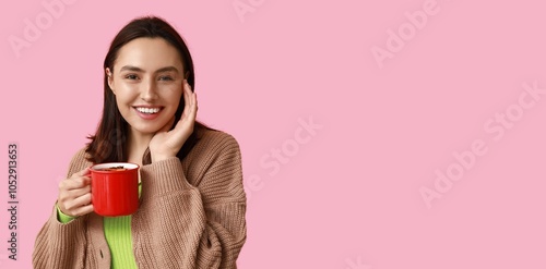 Happy young woman holding m...