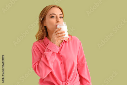 Mature woman drinking milk ...