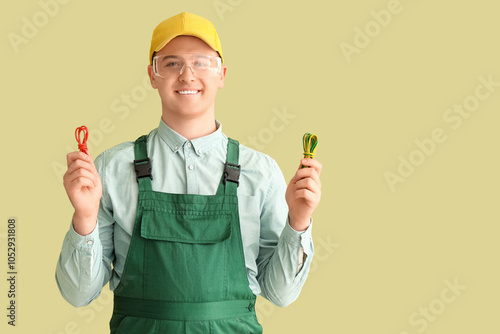 Male electrician with cable...