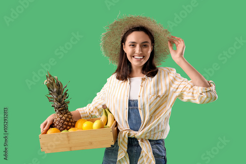 Female farmer with box of f...