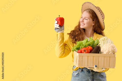 Female farmer with box of f...