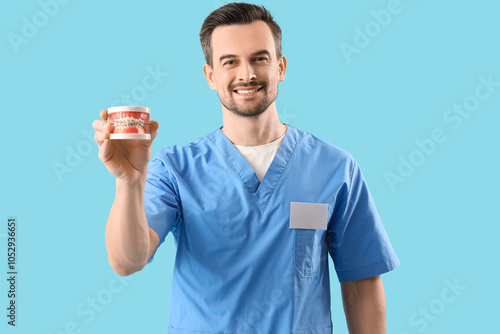 Portrait of male dentist wi...