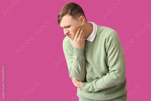 Young man suffering from to...