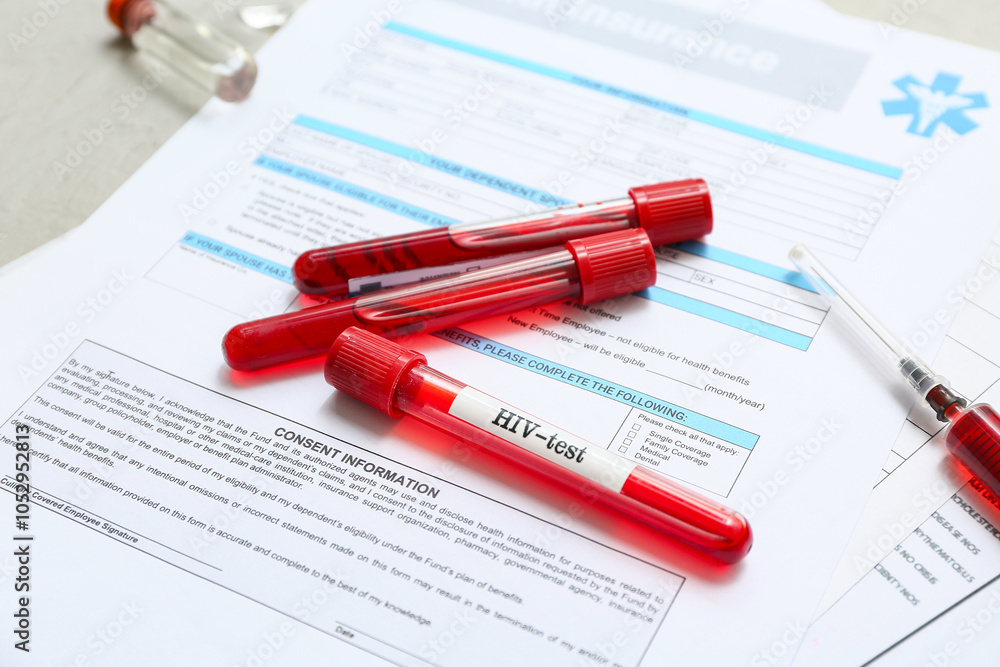 HIV blood test tubes and health insurance form on grey grunge background, closeup HIV blood test tubes and health insurance form on grey grunge background, closeup