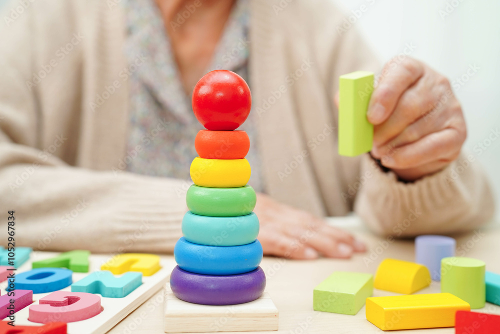 Asian elderly woman playing game. Asian elderly woman playing game.