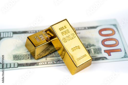 Gold bars and 100-dollar bill on a white background, symbolizing wealth, investment, and financial security