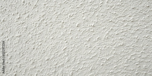 A close-up of a textured white wall with a subtly patterned surface, showcasing a subtle and elegant backdrop for design projects.