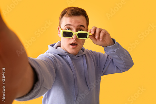 Surprised young man in sung...
