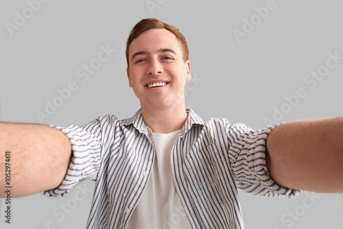 Young man taking selfie on ...