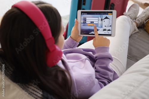 Female tourist in headphone...