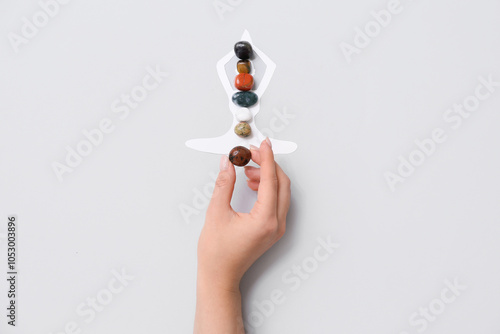 Woman with set of chakra st...