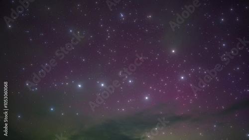 The constellation Ursa Major against the backdrop of the northern lights in the night sky