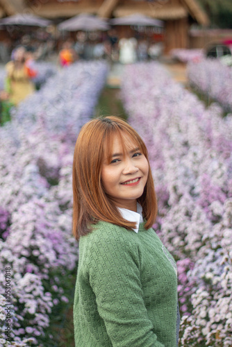 Beautiful asia woman in the flowers field