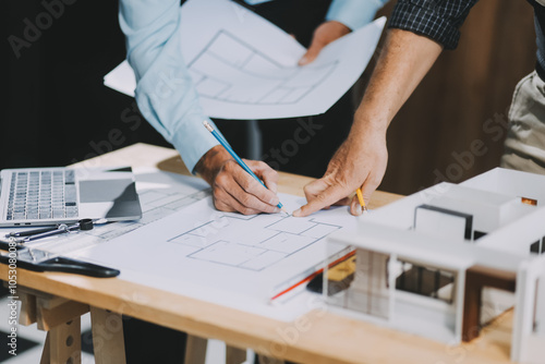 Team Engineers with draft plan of building on constructing site. Engineer work on site. engineer visit and inspection site engineer. Inspector engineer check and working on site.