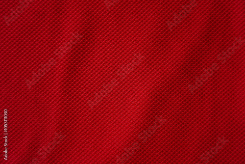 Close up of red football jersey sports clothing fabric texture.