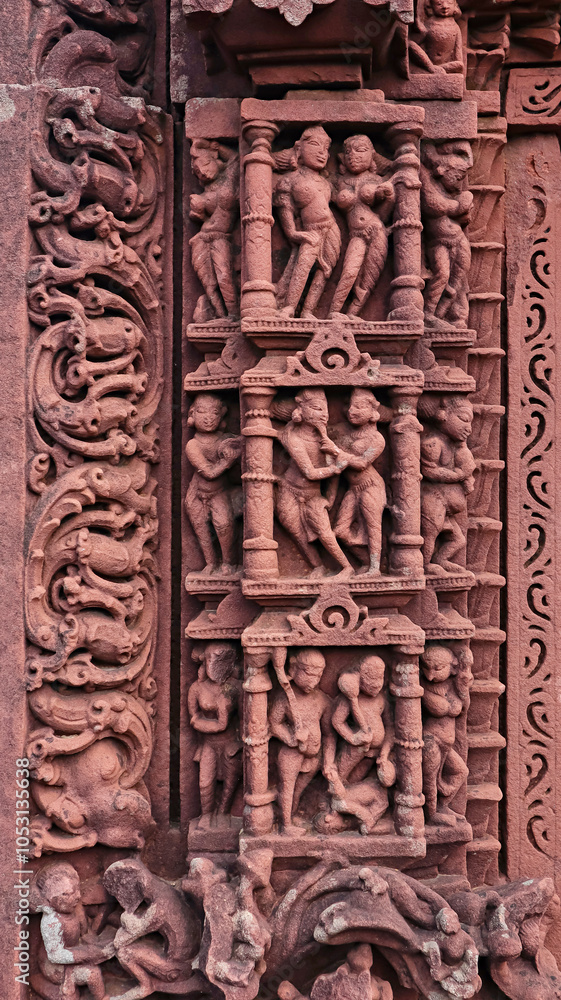 Naklejka premium Carvings of various figures, including love-making couples, on the entrance of the ruined Jain Temple, located in Budhi Chanderi, Madhya Pradesh, India.