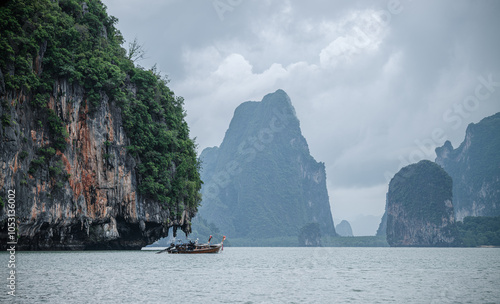 Landscape of Phang Nga bay with a fishing boat. Thailand photo