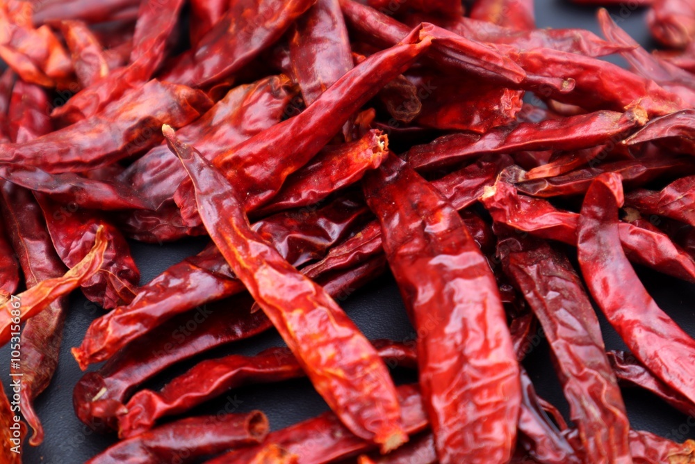 Background and texture of a pile of dried chilies or Capsicum annuum L, with close view. Background and texture of a pile of dried chilies or Capsicum annuum L, with close view.