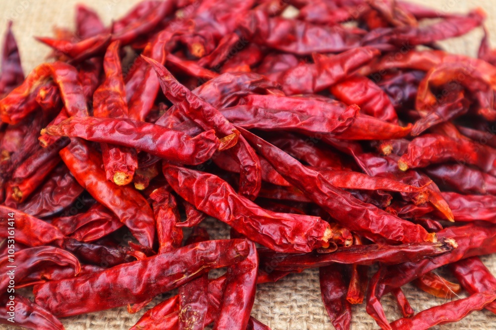 Background and texture of a pile of dried chilies or Capsicum annuum L, with close view. Background and texture of a pile of dried chilies or Capsicum annuum L, with close view.