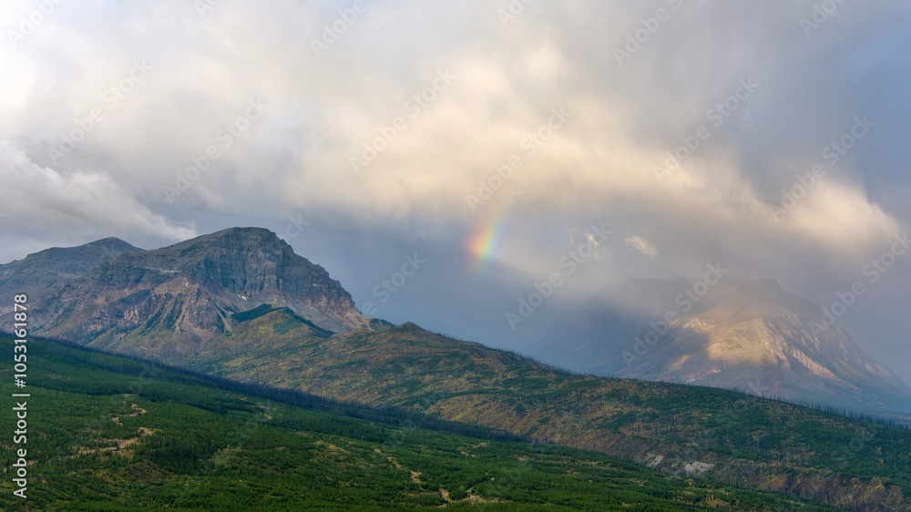 Glacier National Park rainbow at dawn Glacier National Park rainbow at dawn