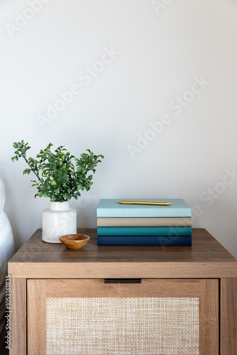Wallpaper Mural Minimalist bedside table with books and greenery Torontodigital.ca