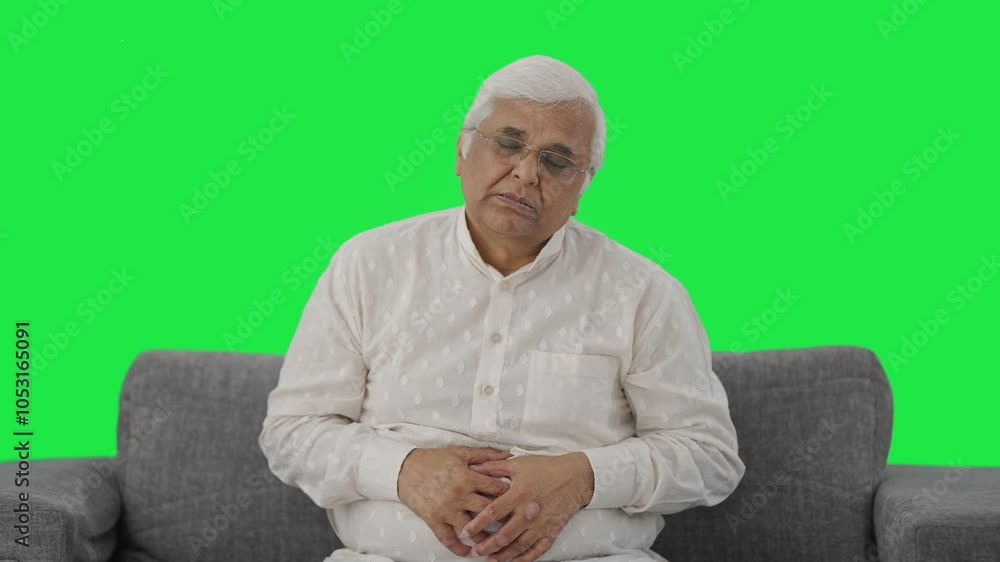 Sick Indian old man suffering from stomach pain Green screen Sick Indian old man suffering from stomach pain Green screen
