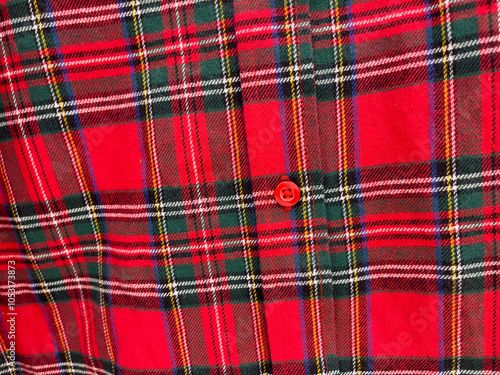 Red and green tartan fabric as a background, closeup of photo