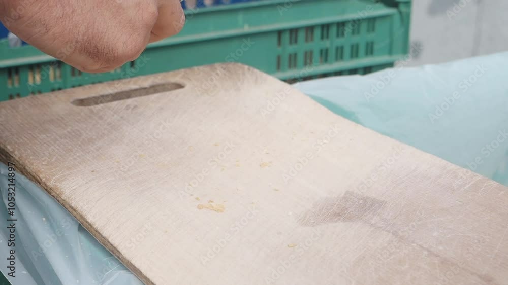 slow motion of cutting long bread on a chopping board at street slow motion of cutting long bread on a chopping board at street