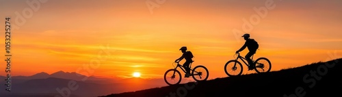 Silhouettes of cyclists against a vibrant sunset landscape