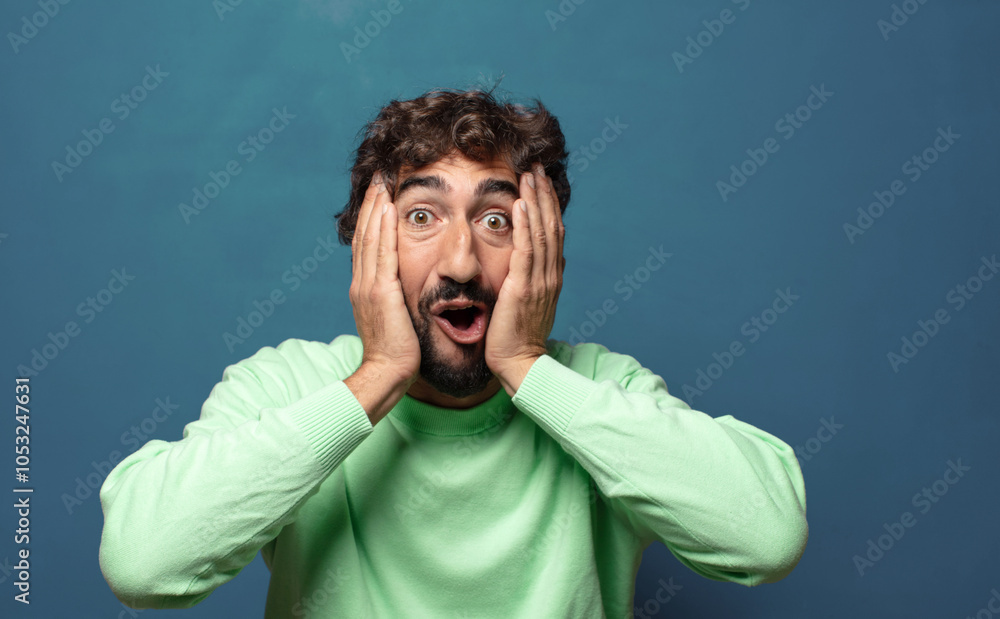 looking excited and surprised, open-mouthed with both hands on head, feeling like a lucky winner looking excited and surprised, open-mouthed with both hands on head, feeling like a lucky winner
