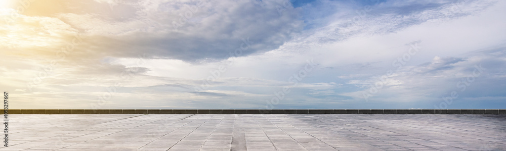 Cement floor view with blue sky and clouds in the background Cement floor view with blue sky and clouds in the background