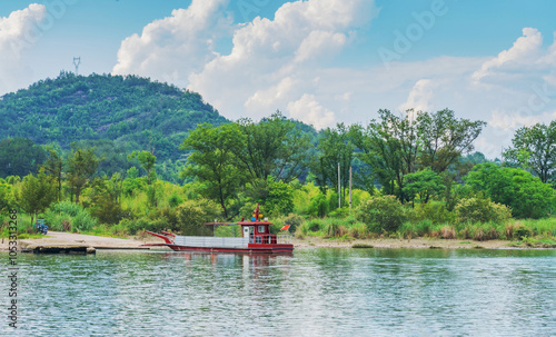 The mountains, Oujiang River, and fishing boats in Lishui City, Zhejiang Province, China	 photo