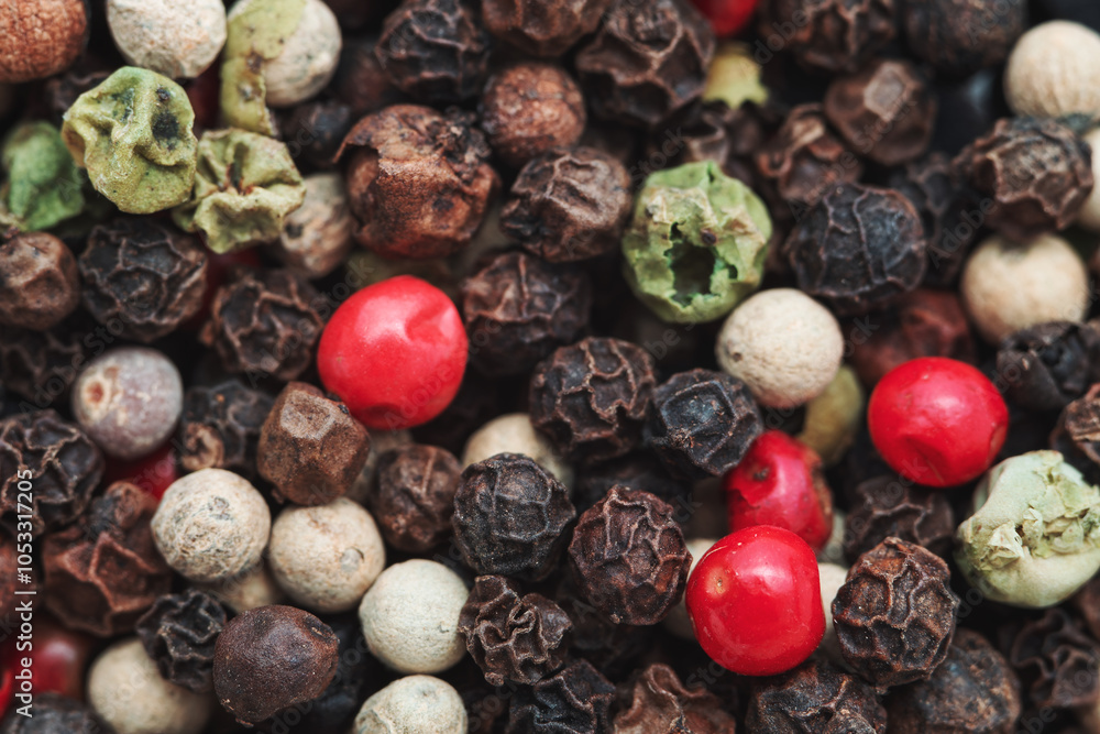 A close-up of a mix of colorful peppercorns, including black, white, green, and red varieties. The different textures and colors of the peppercorns create a rich, vibrant pattern. A close-up of a mix of colorful peppercorns, including black, white, green, and red varieties. The different textures and colors of the peppercorns create a rich, vibrant pattern.