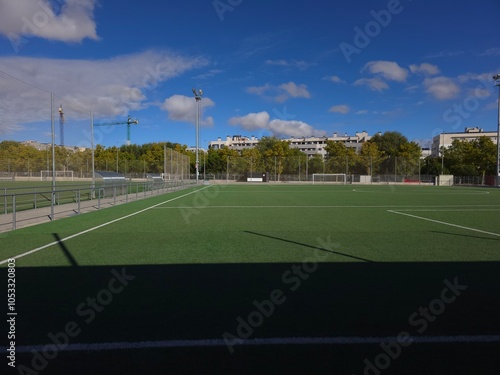 Sunlit Football Field with Clear Blue Skies photo