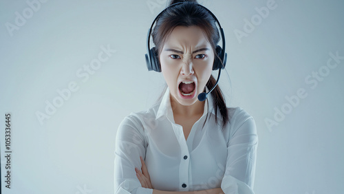 Asian female. Customer support staff wearing headsets, announcers or control tower staff, etc. Copy space. Angry. photo