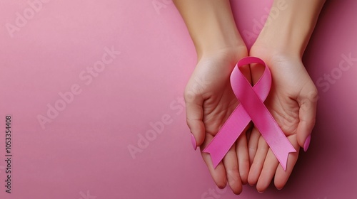 Wallpaper Mural Hands Holding Pink Ribbon on Pink Background. Breast Cancer Awareness Symbol for Hope, Support, and Prevention Campaigns. Torontodigital.ca