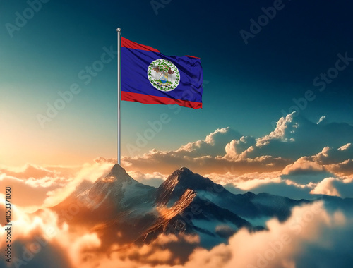 The majestic Belize flag proudly flies over the mountain tops, illuminated by a golden sunrise among the clouds. A national holiday. Celebration concept. photo