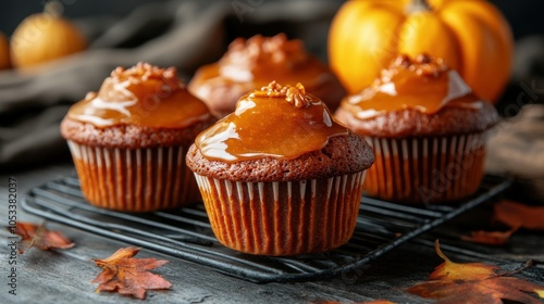 Freshly baked pumpkin muffins with glaze