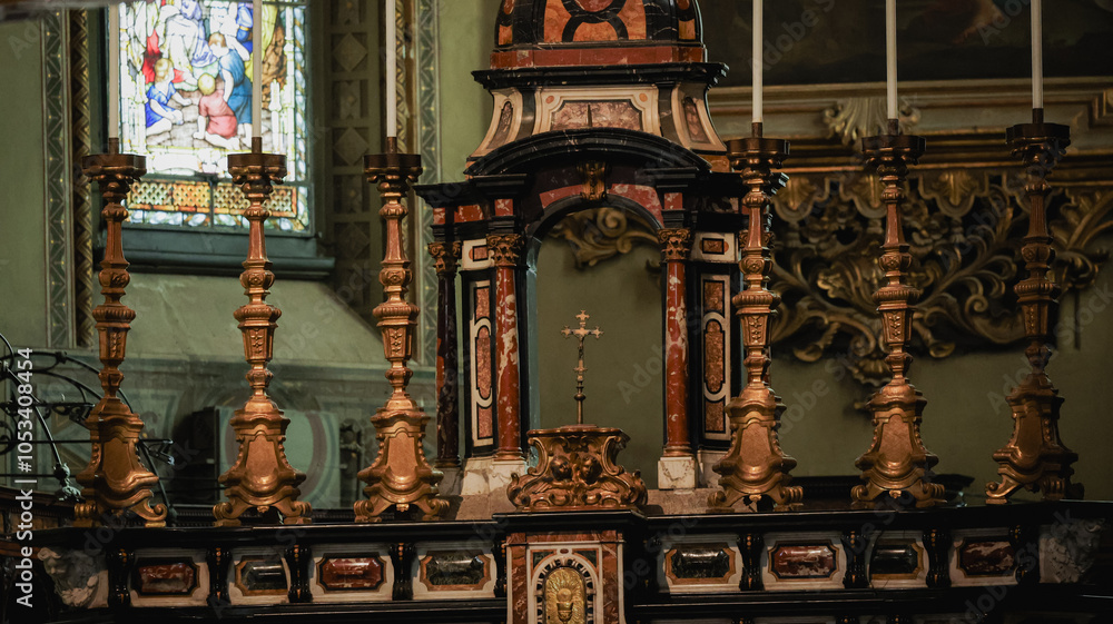 An intricately designed altarpiece is displayed in a historic church in Alba Italy An intricately designed altarpiece is displayed in a historic church in Alba Italy