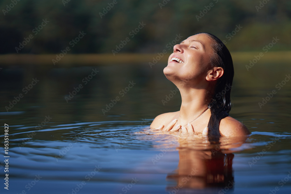 Fototapeta premium Woman in nature swimming in the lake