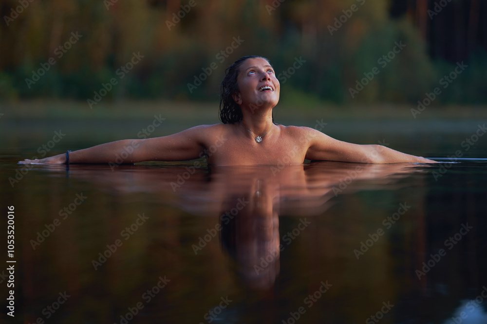 Woman in nature swimming in the lake Woman in nature swimming in the lake