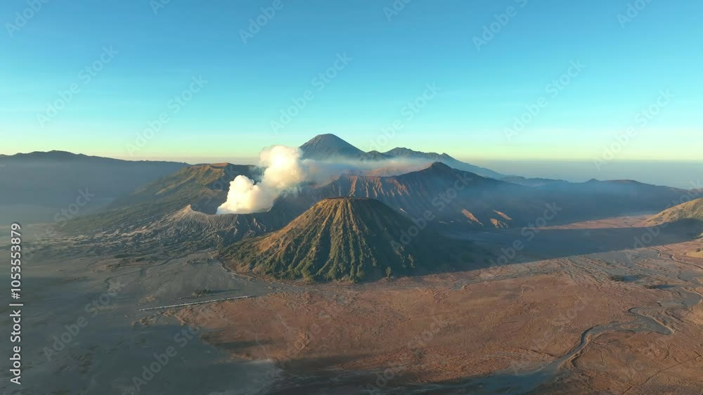 Aerial view of Amazing Mount Bromo volcano during sunrise sky,Beautiful Mountains Penanjakan in Bromo Tengger Semeru National Park,East Java,Indonesia.Nature landscape background Aerial view of Amazing Mount Bromo volcano during sunrise sky,Beautiful Mountains Penanjakan in Bromo Tengger Semeru National Park,East Java,Indonesia.Nature landscape background