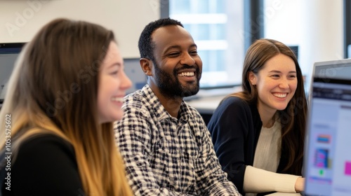 Diverse Team of Tech Professionals Collaborating and Smiling in Modern Office Setting