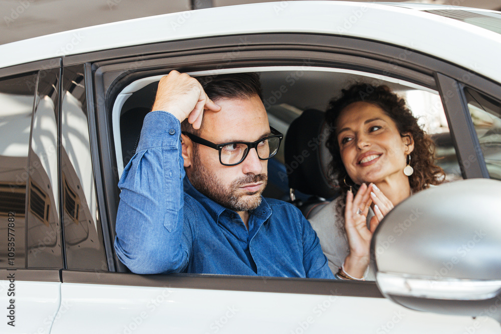 Naklejka premium Couple in Car Having a Discussion with Mixed Emotions