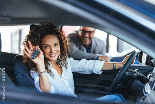 Happy Customer Holding Car Keys in New Vehicle photo